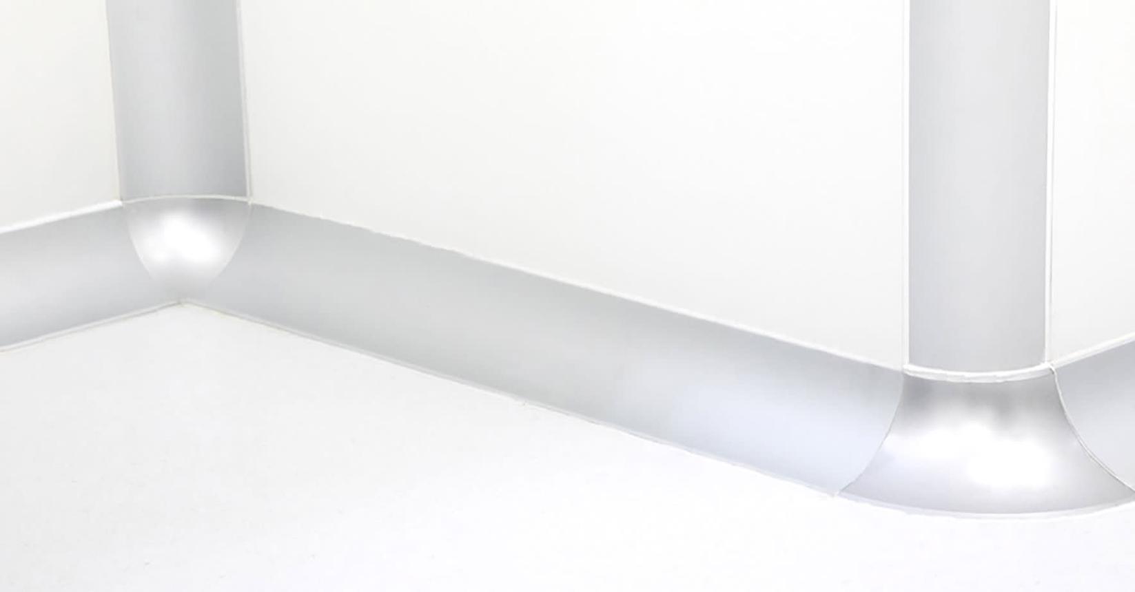 Radiused cleanroom coving at a wall-to-wall and wall-to-ceiling junction