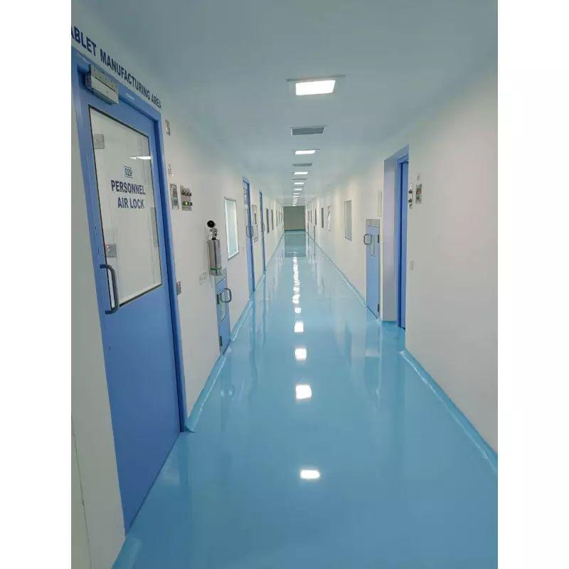 Cleanroom corridor with a seamless glossy epoxy floor and flush doors