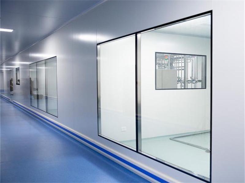 Cleanroom corridor with flush double-glazed observation windows set into the wall panels